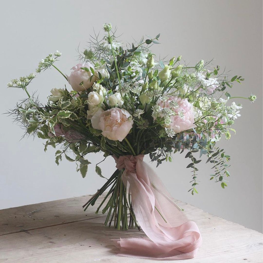Pod & Pip's beautiful bridal bouquet featuring pink pink ribbon