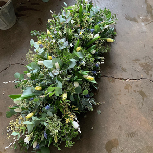 A photograph featuring Pod & Pip's funeral flower arrangements