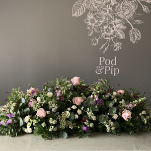 A photograph featuring Pod & Pip's funeral flower arrangements